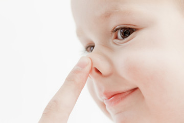 tender lips and nose and finger of a child wake up, closeup