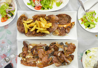 roasted beef and lamb served on a restaurant table