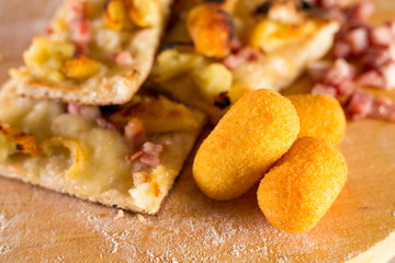 Pizza with potato croquettes and square bacon
