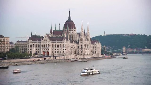 Beautiful scenery with boats floating on the Danube in Budapest, Hungary.