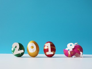 Miniature people painting color with creative colorful egg in happy new year concept,2018