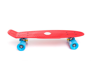 Red plastic skateboard on white background © F8  \ Suport Ukraine
