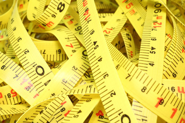 Group of tape measures on a white background.