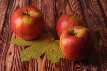 Fresh, ripe apples on an old wooden table. Fruit to comply with the diet