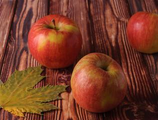 Fresh, ripe apples on an old wooden table. Fruit to comply with the diet