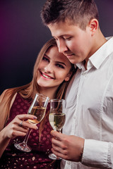 Couple celebrating New Year's eve drinking champagne