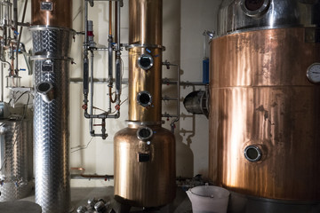 Copper still alembic inside distillery - obrazy, fototapety, plakaty