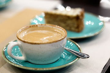 Cup of coffee latte art on a table