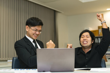 Two Asian businessmen success concept,Thailand employee happy from work finished