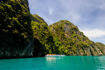 Karst rocks and turquoise sea in the bay of Phi Phi.