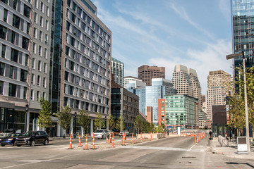 Fototapeta na wymiar Boston MA USA skyline summer day panoramic view buildings downtown and road with traffic at waterfront side