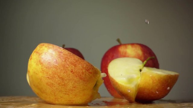 The apple falls on the table in slow motion