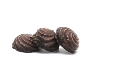 Chocolate covered marshmallows on white background