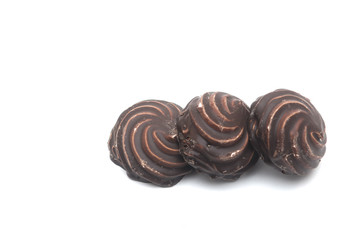 Chocolate covered marshmallows on white background