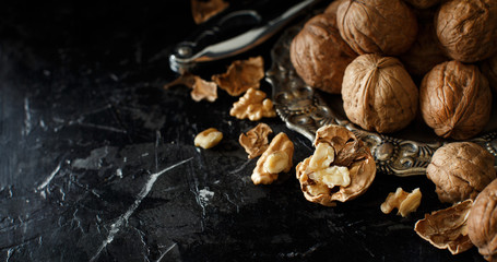 Fresh walnuts on a dark background