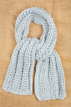 Woolen scarf isolated on linen background.