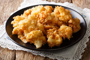 Crispy roasted cauliflower close-up on a plate. horizontal