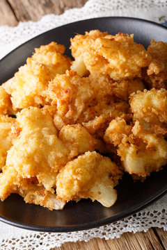 fried cauliflower in breading close-up. vertical