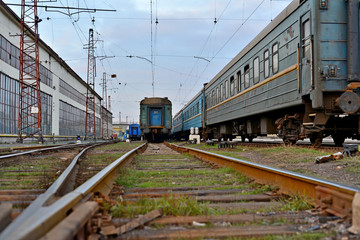 Fototapeta premium Passenger and freight train. Passenger diesel train traveling speed railway wagons journey light