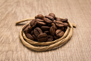 coffee beans seed. Paper rope around grain. Selective focus.