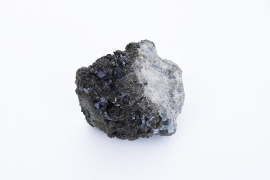 Andradite mineral isolated over white