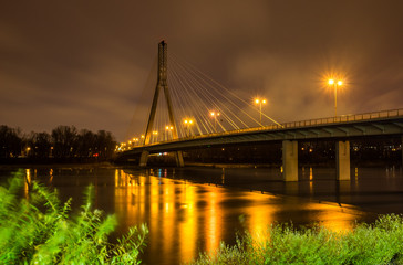Swietokrzyski bridge over the Vistula river at night  in Warsaw, Poland
