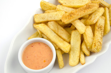 potato fries and sauce on the plate on the white background