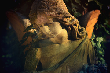 Fototapeta premium Majestic view of statue of golden angel illuminated by sunlight