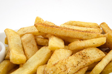 potato fries and sauce on the plate on the white background