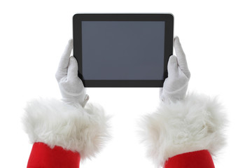 Christmas concept shot with Santa holding a digital tablet, showing it into the camera Isolated on white