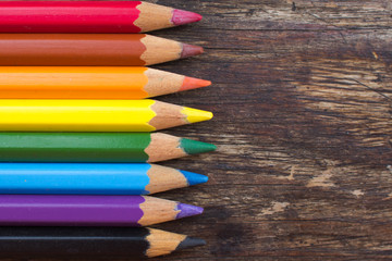 Color pencils on a wooden table