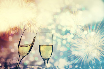 Champagne glasses on sparkling background