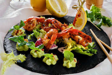 Barbecue grilled prawns with guacamole salad