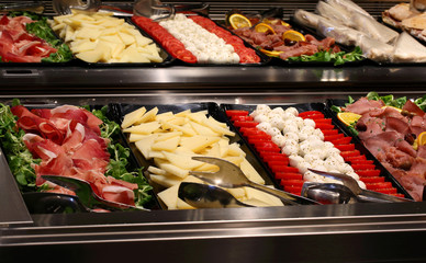 bar with tray filled with tomato mozzarella cheeses and vegetabl