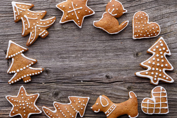 Gingerbread Christmas cookie background. Christmas homemade gingerbread cookies on wooden background.