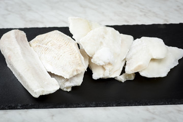frozen fish on stone plate