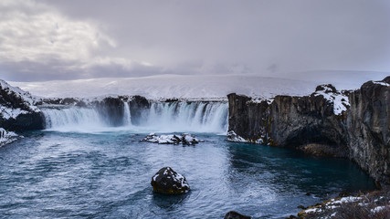 The iconic Goðafoss waterfall in winter, North Iceland