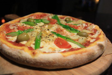 pizza with mozzarella and greens