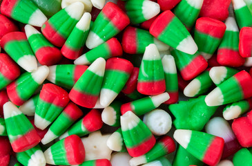 background wallpaper full frame close up of red, green and  white Christmas candy corn