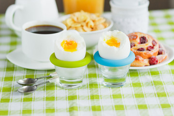 Soft boiled chicken egg, coffee, muesli and orange juice