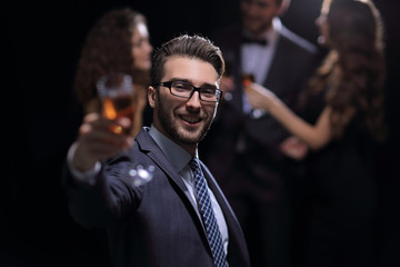elegant man raising his glass with the toast