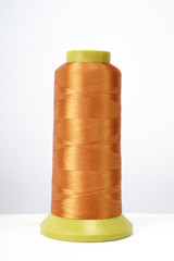 Spool of thread isolated on white background