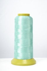 Spool of thread isolated on white background