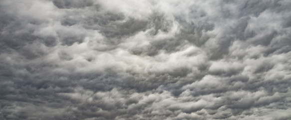 The panorama of overcast texture with clouds. Copy space.A lot of clouds in dramatic filter.