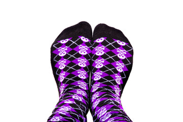 Fun purple and black socks with skulls on isolated white background