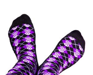 Fun purple and black socks with skulls on isolated white background