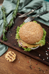 delicious burger on wooden table