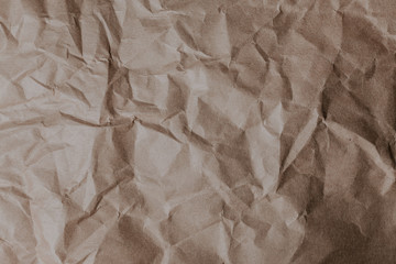 Wrinkled brown paper pattern background.