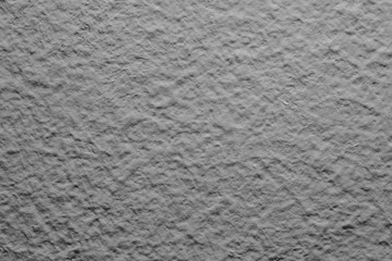 Gray concrete wall closeup pattern background.