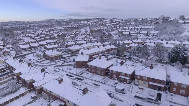 Drifting winter aerial shot over a UK housing estate.